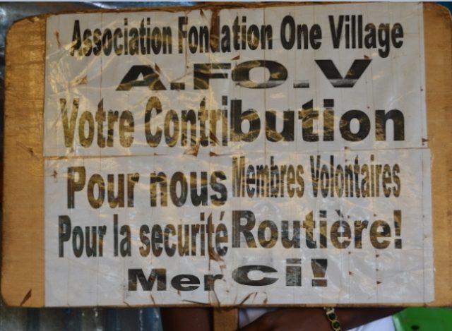 Pancarte de demande de soutien AFOV présentée pendant leur action