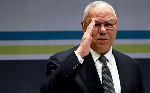 FILE PHOTO: Former U.S. Secretary of State Powell salutes the audience as he takes the stage at the Washington Ideas Forum in Washington