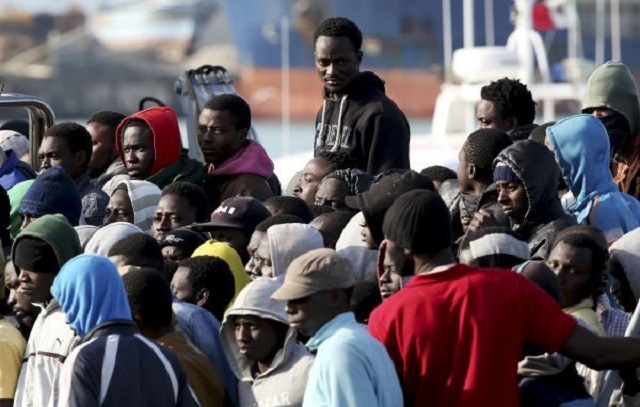 Migrants arrive at the Sicilian harbor of Catania